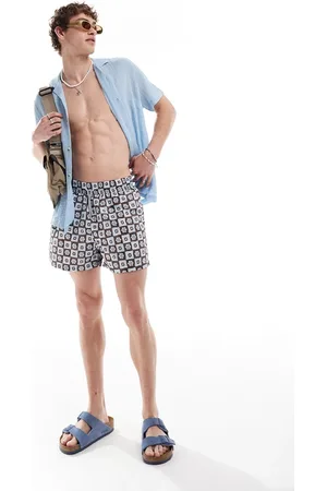 Reclaimed Swim shorts in blue floral tile print