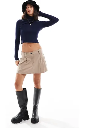 ASOS Knitted roll neck top in engineered rib in navy