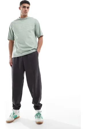 ASOS Oversized sweatpants in washed deep navy
