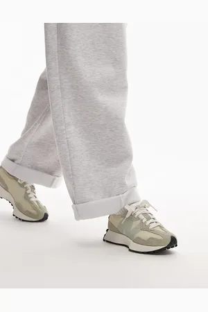 New Balance 327 sneakers in beige with pale green and detail