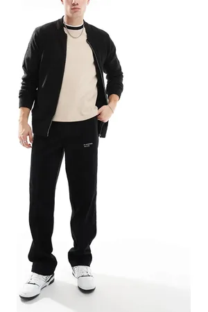 ASOS Baggy cord pants with embroidered patch in