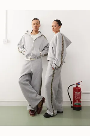 Reclaimed Unisex plaid side stripe wide leg sweatpants in heather