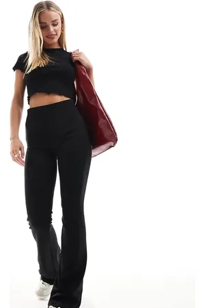 Stradivarius Petite deep waistband sculpt flared pants in