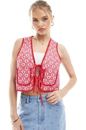 The Frolic Exclusive heart quilted reversible tie front vest in floral and red stripe