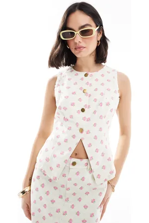 The Frolic Exclusive button up split front denim vest in cream and pink floral - part of a set