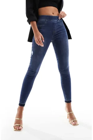 Spanx Shape and lift distressed skinny jeans in medium wash