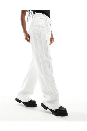 KYÒ The Brand extreme frayed mid rise jeans in