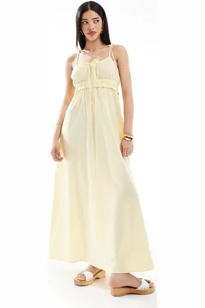 Esmée Exclusive maxi beach dress with tie straps and bow detail in butter