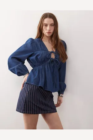 Reclaimed Long sleeve ruched tie front top in mid denim