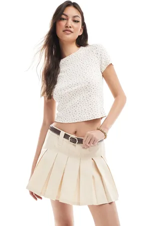 Monki Pleated mini skirt with white layered raw hem detail in beige