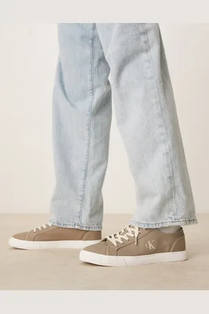 Calvin Klein Essential low canvas sneakers in beige and white