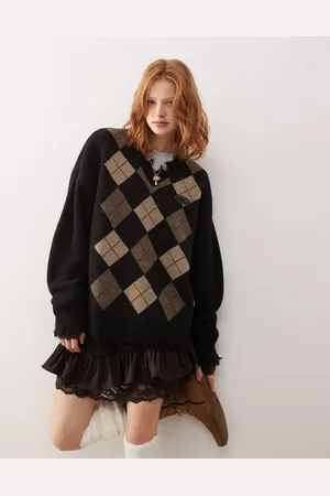 Minga London argyle v-neck sweater with distressed edges in black and beige