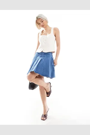 Pieces® Pleated mini skirt in light denim wash
