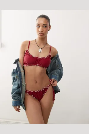 Reclaimed Tie side bikini bottoms with frills in burgundy