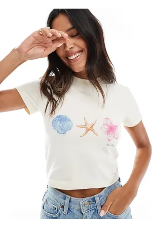 The Frolic Exclusive baby tee with printed floral shell graphic logo in cream