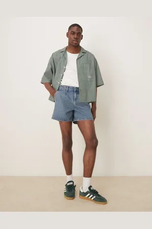 ASOS Short length slim denim shorts with pleats in mid wash