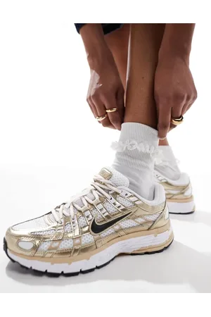 Nike P-6000 sneakers in and gold