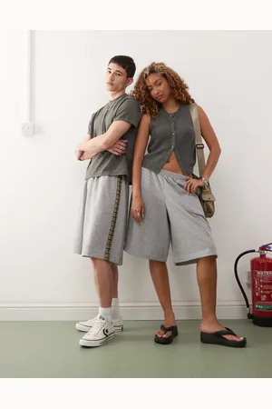 Reclaimed Unisex jersey shorts with plaid side detail in heather