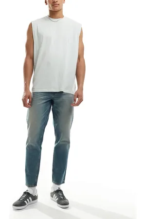 ASOS Tapered fit jeans with tint in light wash