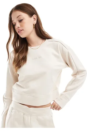 Calvin Klein Tonal Logo lounge crew neck sweatshirt in cream