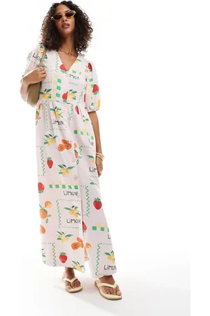 Pieces® Puff sleeve button front maxi dress in pale based fruit print