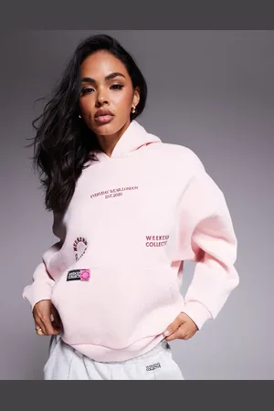 ASOS Weekend Collective hoodie with bright label detail in washed
