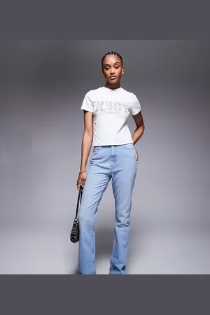 ASOS ASOS DESIGN Tall mid rise flare jeans in light mid wash