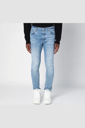 AMIRI Light Washed Skinny Jeans With Wear