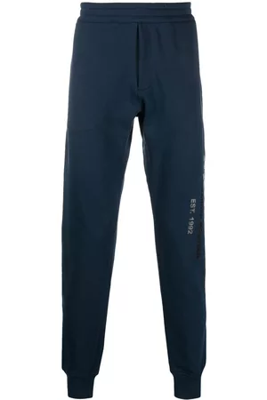 Alexander McQueen Men Sweatpants - Graffiti logo-print track pants - Blue