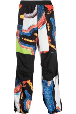 AMBUSH Men Sweatpants - Abstract-pattern paneled track pants - Black