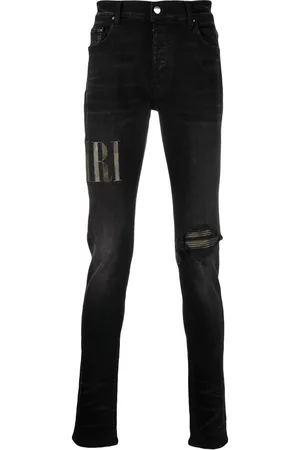 AMIRI Men Skinny Jeans - Leather logo-patch skinny jeans - Black