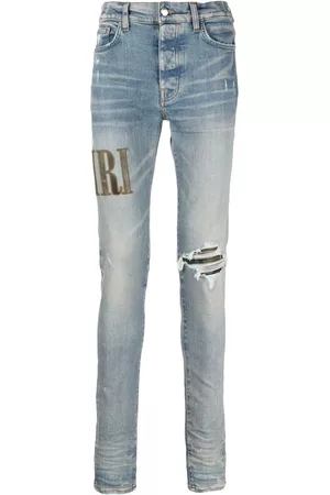 AMIRI Men Slim Jeans - Logo-embroidered ripped-detail jeans - Blue