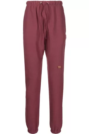 ADVISORY BOARD CRYSTALS Logo-patch track pants - Red
