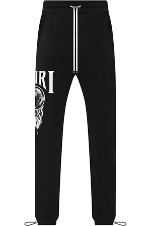 AMIRI Graphic-print cotton track pants - Black