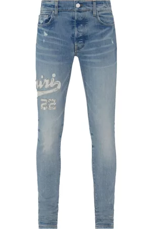 AMIRI Men Skinny Jeans - Varsity logo appliqué skinny jeans - Blue