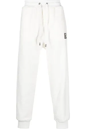 Dolce & Gabbana Gold-tone logo cotton track pants