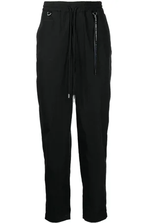 MASTERMIND Logo-print tapered-leg trousers