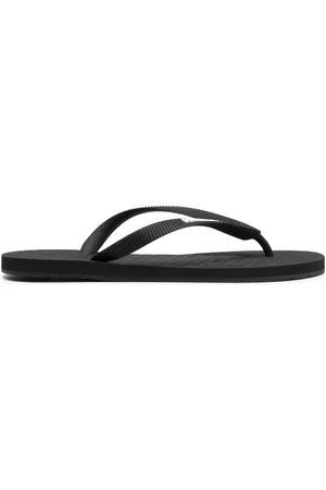 Vetements Flip Flops - Logo-embossed flip flops - Black