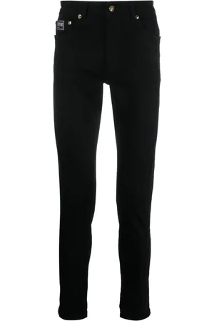 VERSACE Logo-patch cotton trousers