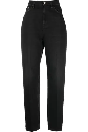 Totême Faded-effect tapered-leg jeans