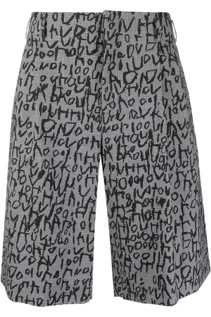 Comme des Garçons Text-print plaid-check tailored shorts