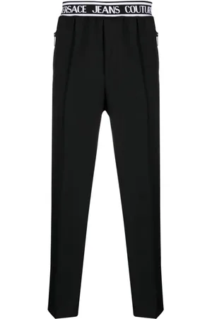 VERSACE Logo-waistband slim-cut trousers