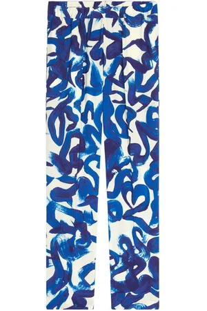 DRIES VAN NOTEN Abstract print slim-fit trousers