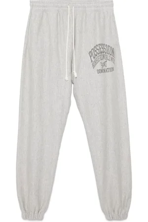 SAINT MXXXXXX Slogan-printed track pants