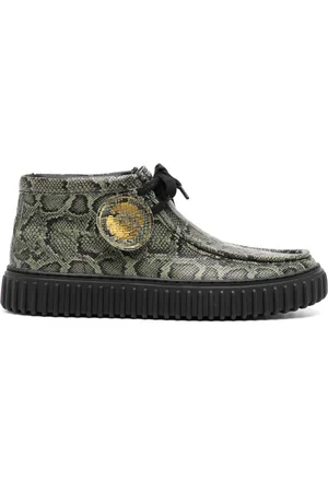 MARTINE ROSE Snake-print leather boots