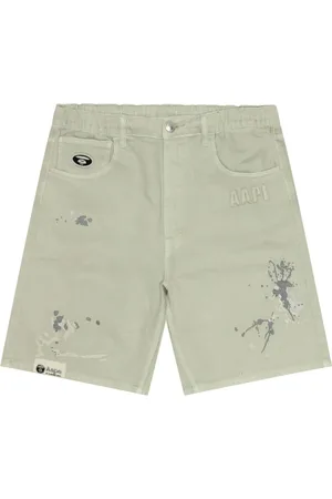 A Bathing Ape Paint-splatter denim shorts