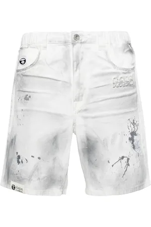 A Bathing Ape Paint-splatter denim shorts