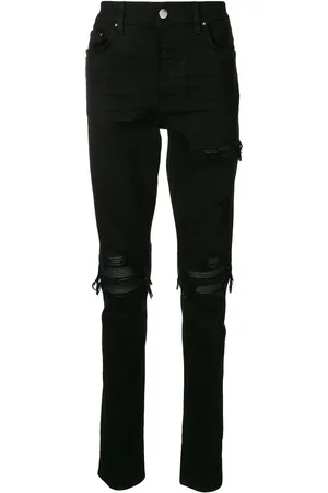 AMIRI Distressed skinny jeans