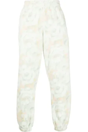MARTINE ROSE Textured floral-print track pants
