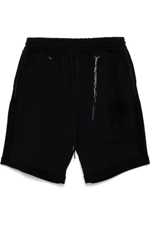 MASTERMIND Cut-off track shorts